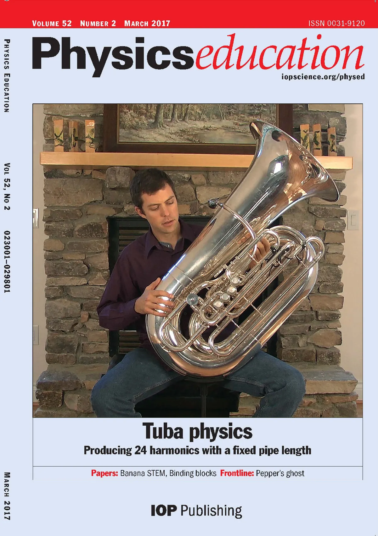 Physics Education cover with musician holding tuba in Doc's living room.